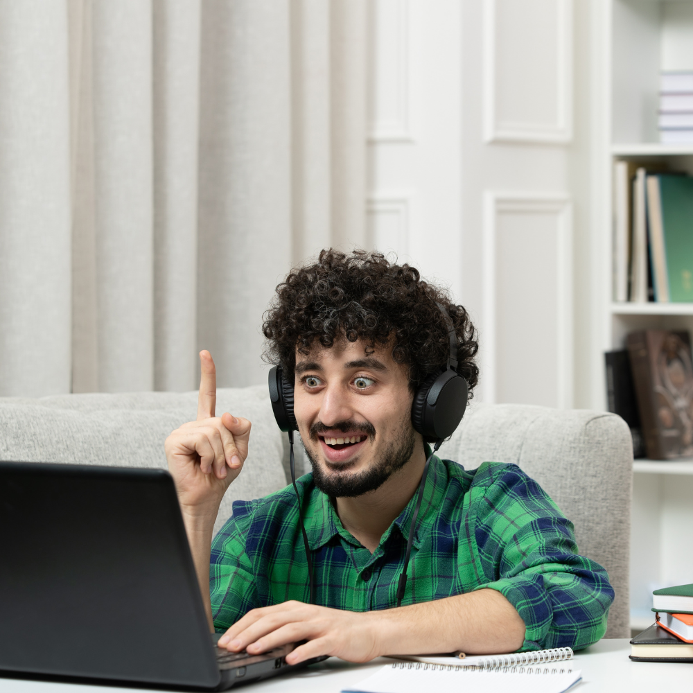 a teacher teaching online in green check shirt .