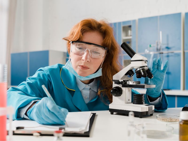 young-woman-with-microscope and diary pan.